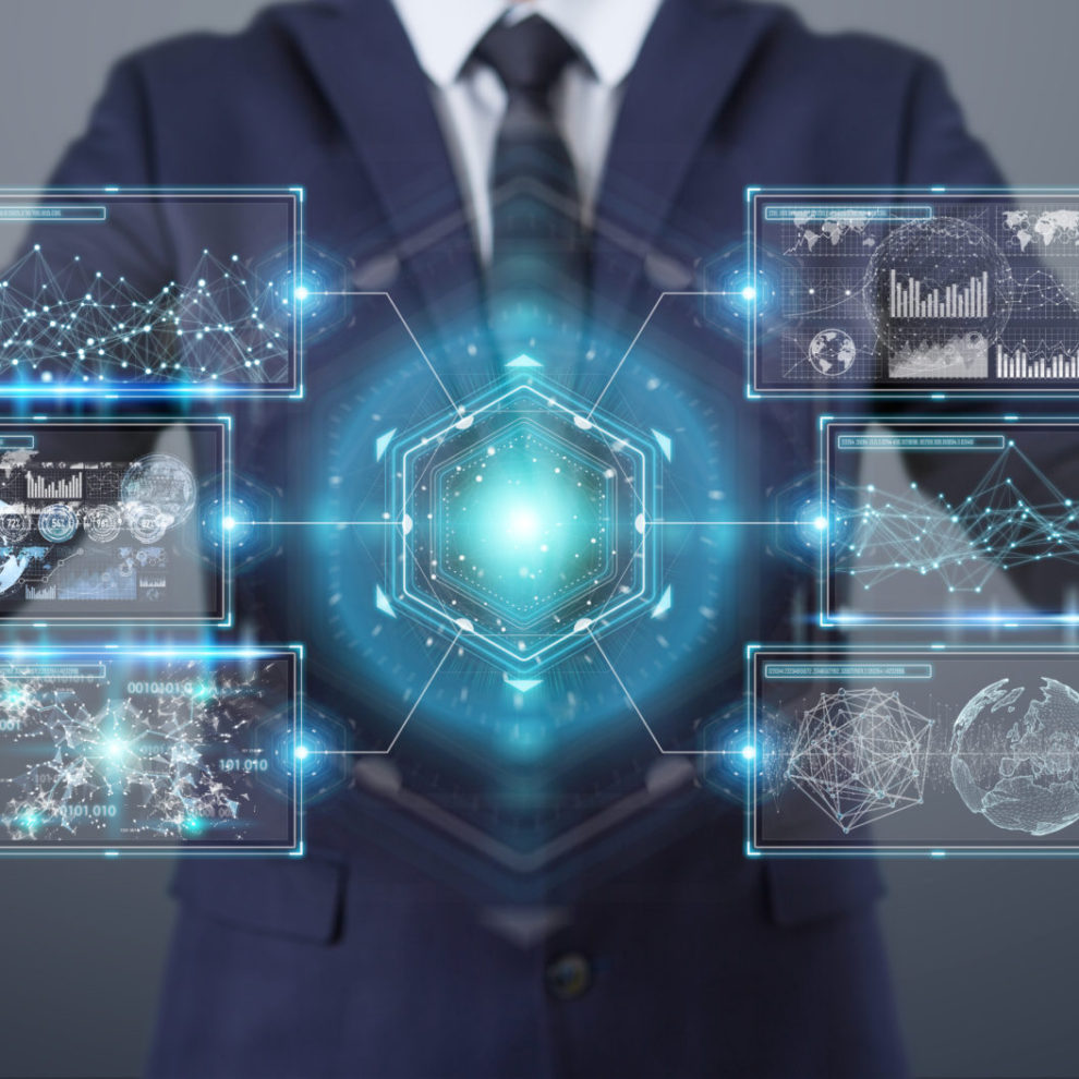 Businessman using digital screens interface with holograms datas